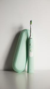 Mint green electric toothbrush and case