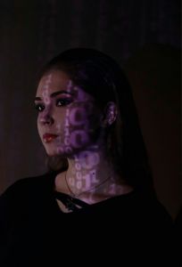 projection of binary on a woman's face